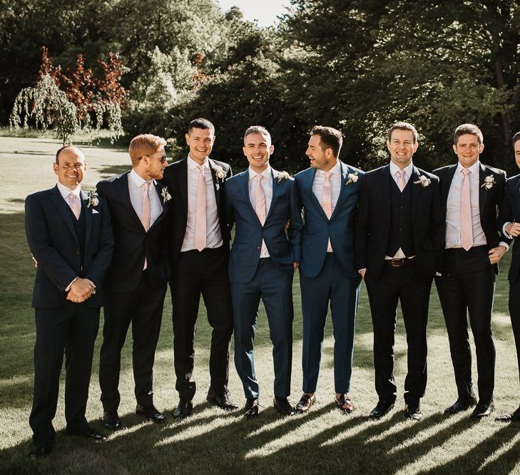 Groom and Groomsmen in Grey Suits with Pink Ties