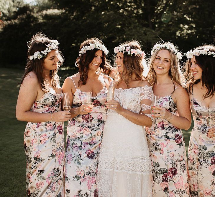 Bride in Lace Boho Dress with Bridesmaids in Floral ASOS Dresses