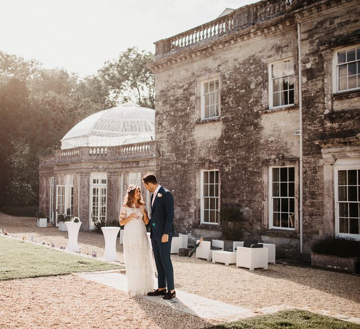 Bride and Groom Outside Country House Wedding Venue