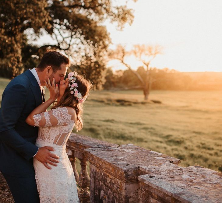 Bride and Groom Kiss At Sunset