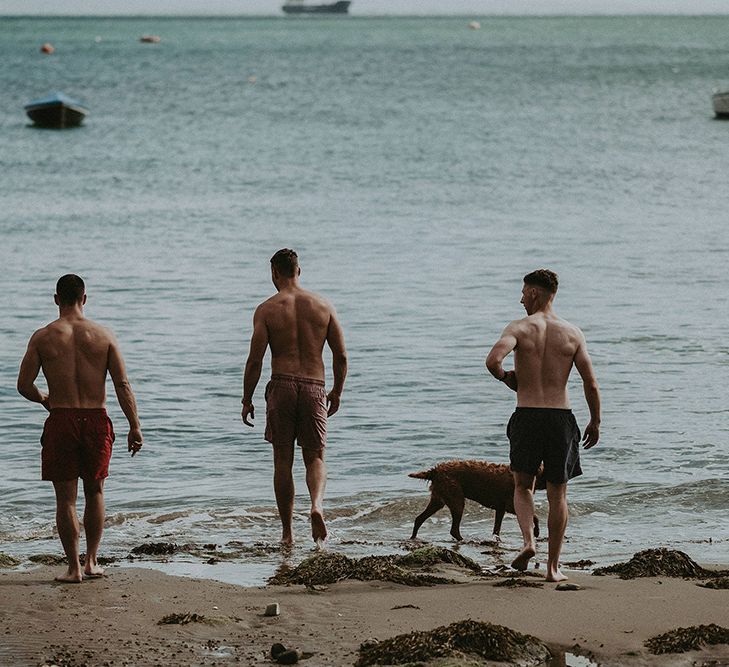 Groomsmen Enjoying the Wedding Morning by Taking a Dip in the Sea