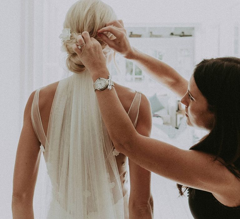 Bride Getting Ready in Her Rime Arodaky Wedding Dress