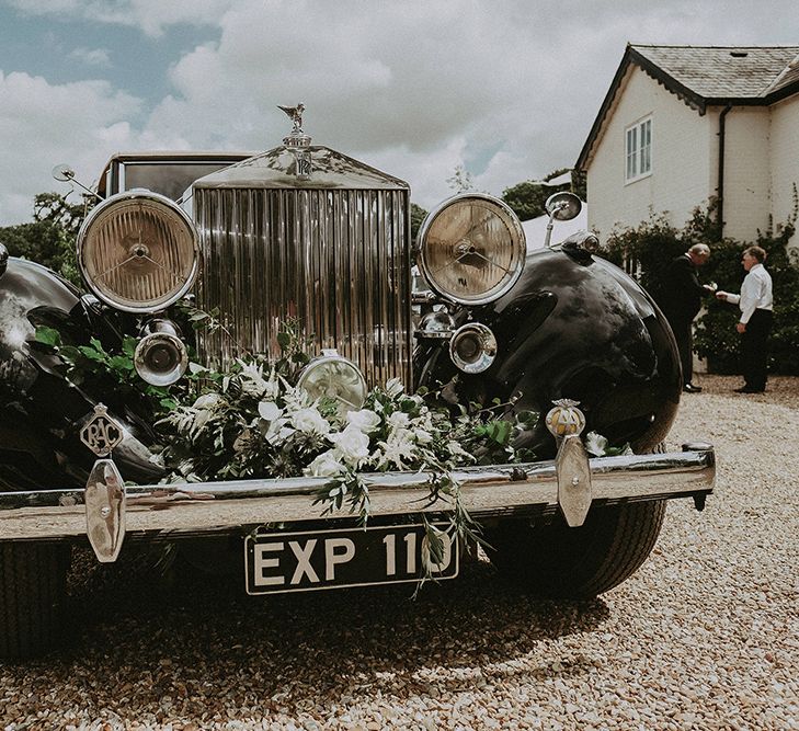 Vintage Wedding Car with Flowers on the Bonnet