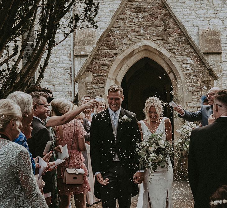 Confetti Moment with Bride in Rime Arodaky Wedding Dress and Groom in Traditional Morning Suit