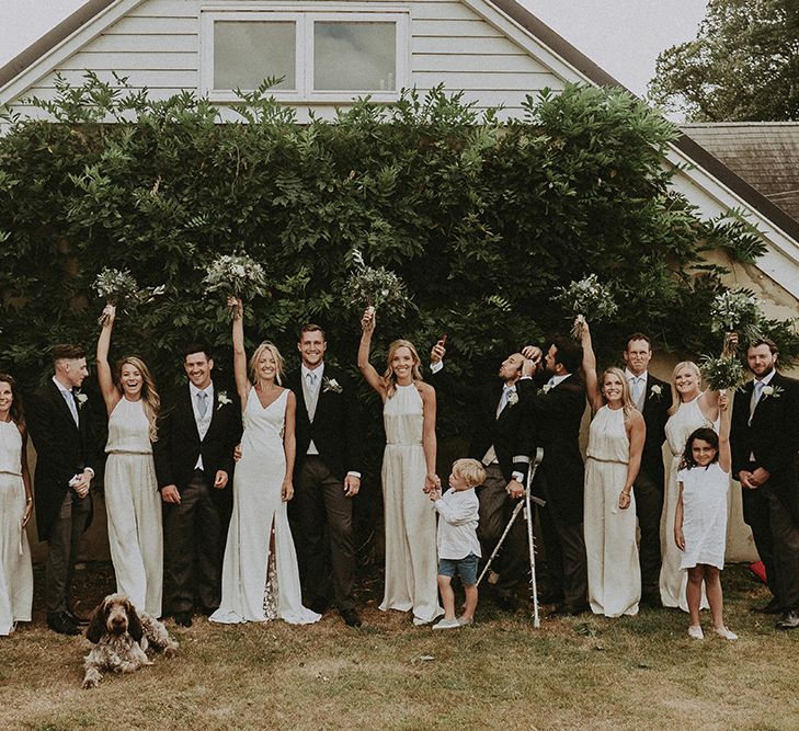 Wedding Party Portrait with Groomsmen in Traditional Morning Suits, Bridesmaids in White Ghost Dress and Bride in Rime Arodaky