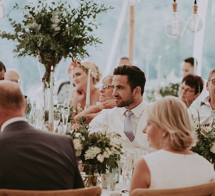 Wedding Guests Enjoying The Speeches During the Sperry Tent Reception