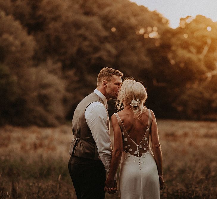 Sunset Portrait with Bride in Rime Arodaky Wedding Dress with Lace Back and Groom in Morning Suit