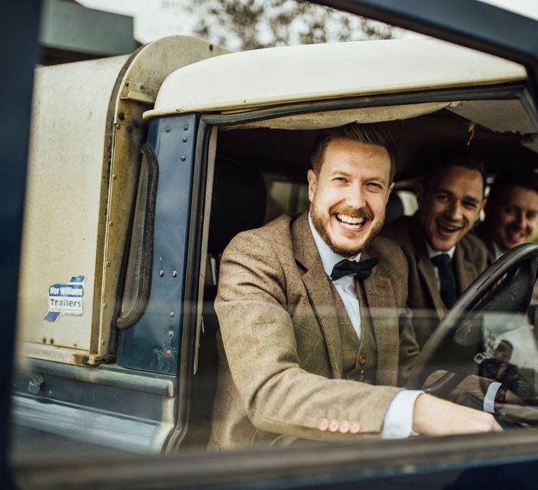 Groom and groomsmen in wedding car on arrival