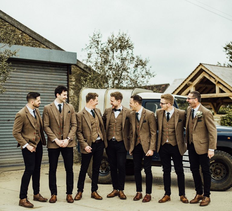 Groom and groomsmen in matching tweed suits