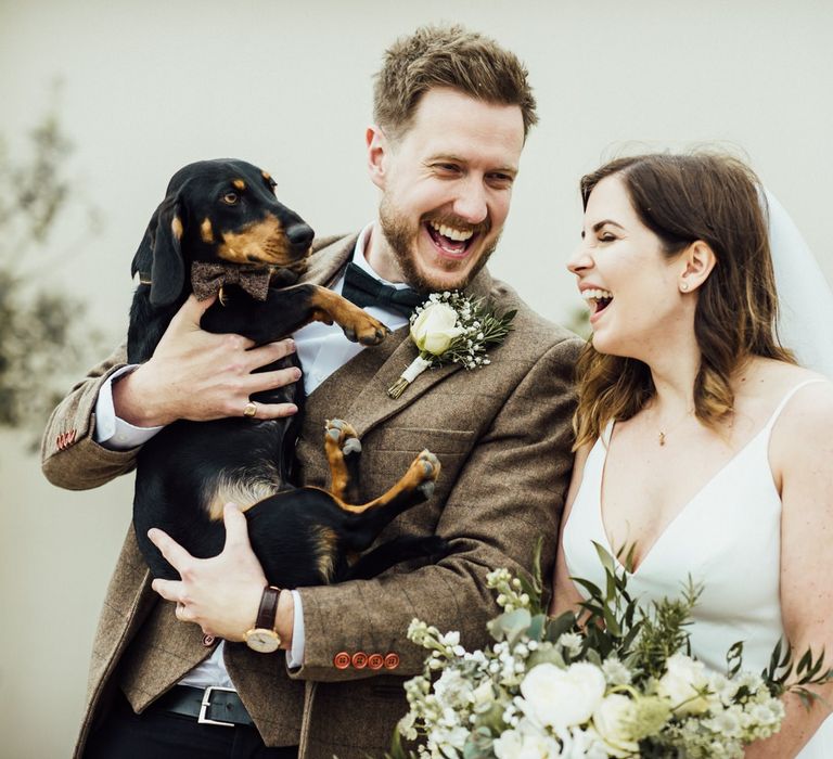 Couple have dachshund at Oxfordshire barn wedding