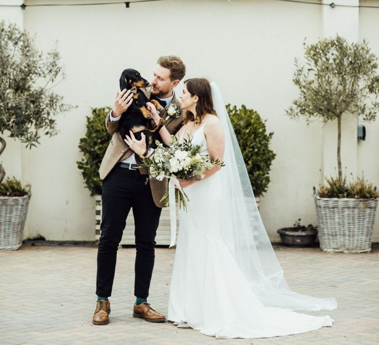 Couple have dachshund at Oxfordshire barn wedding