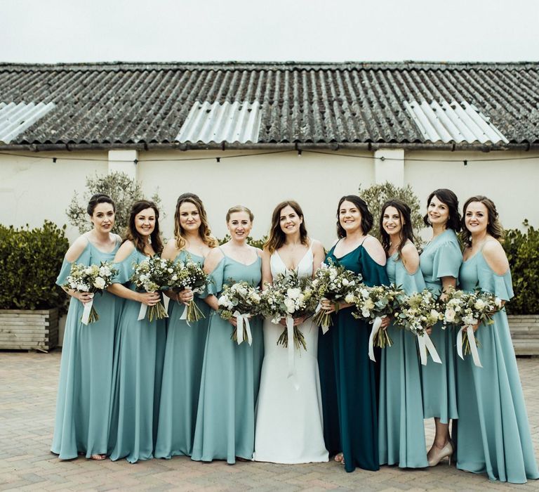 Blue Rewritten bridesmaid dresses with bride in Sassi Holford bride dress