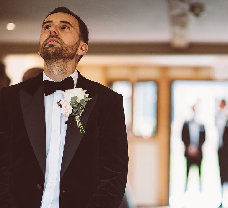 Groom at the Altar in Black Tie Suit | Blush Pink &amp; Red, Christmas, Winter Wedding at Coltsfoot Country Retreat | Lemonade Pictures