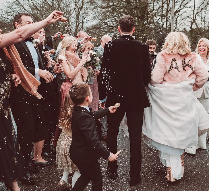 Confetti Moment | Bride in Organza Justin Alexander Gown &amp; Blush Pink Customised Faux Fur Coverup | Groom in Black Tie Suit | Blush Pink &amp; Red, Christmas, Winter Wedding at Coltsfoot Country Retreat | Lemonade Pictures