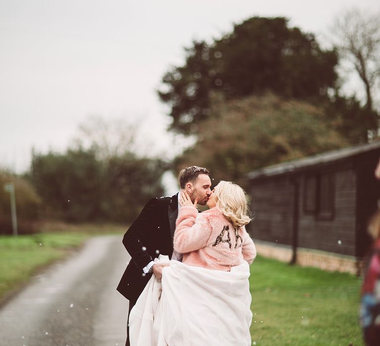 Bride in Organza Justin Alexander Gown &amp; Blush Pink Faux Fur Coverup | Groom in Black Tie Suit | Blush Pink &amp; Red, Christmas, Winter Wedding at Coltsfoot Country Retreat | Lemonade Pictures