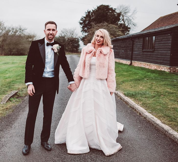 Bride in Organza Justin Alexander Gown &amp; Blush Pink Faux Fur Coverup | Groom in Black Tie Suit | Blush Pink &amp; Red, Christmas, Winter Wedding at Coltsfoot Country Retreat | Lemonade Pictures