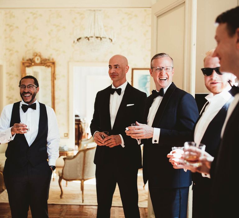 Groomsmen in tuxedos on wedding morning