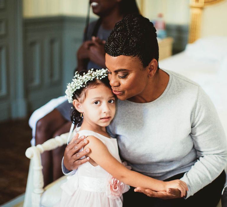 Grandmother and flower girl with gypsophila flower crown on wedding morning