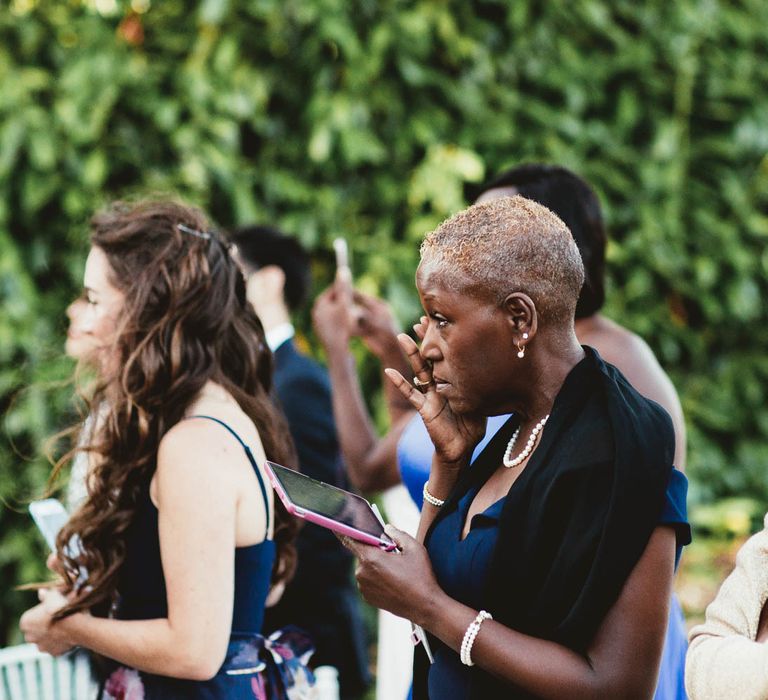 Wedding guests at outdoor ceremony at Chateau La Durantie, France