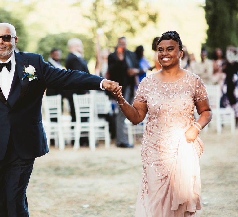 Mother and Father of the bride walking up the aisle