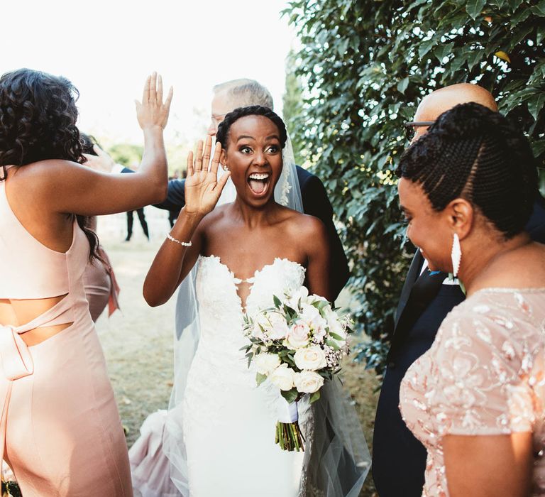 Happy bride in strapless Pronovias wedding dress