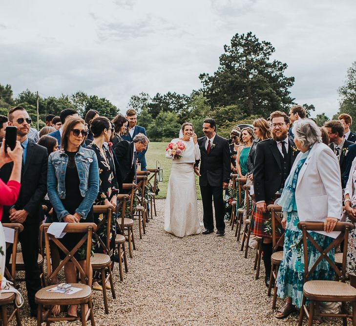 Bride in Halfpenny London Separates of Laura Top with Cowl Back and Long Sleeves, Silk Cami and Laser Cut Palm Skirt | Colourful Bridal Bouquet of Pink and White Peonies | Outdoor Wedding Ceremony at Abbey Hall Creative Space | 'Frida Kahlo' Flower Crown, Halfpenny London Bridal Separates and Colourful Bouquets with Peonies for Suffolk Wedding | From The Smiths Photography