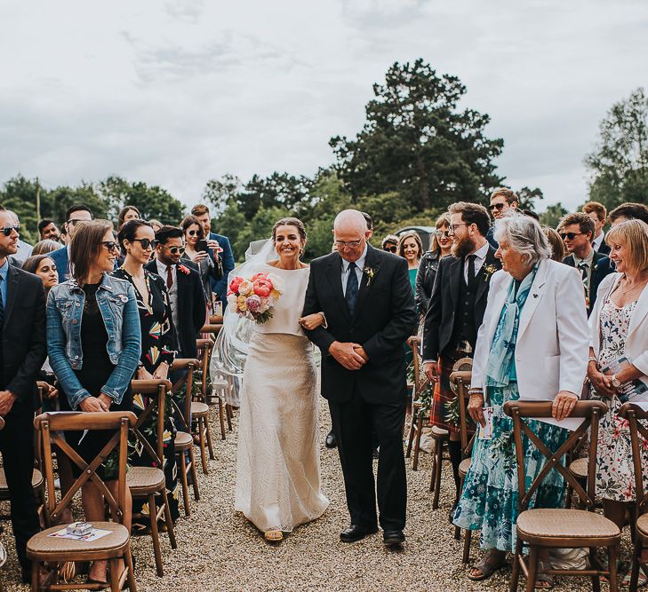 Bride in Halfpenny London Separates of Laura Top with Cowl Back and Long Sleeves, Silk Cami and Laser Cut Palm Skirt | Colourful Bridal Bouquet of Pink and White Peonies | Outdoor Wedding Ceremony at Abbey Hall Creative Space | 'Frida Kahlo' Flower Crown, Halfpenny London Bridal Separates and Colourful Bouquets with Peonies for Suffolk Wedding | From The Smiths Photography