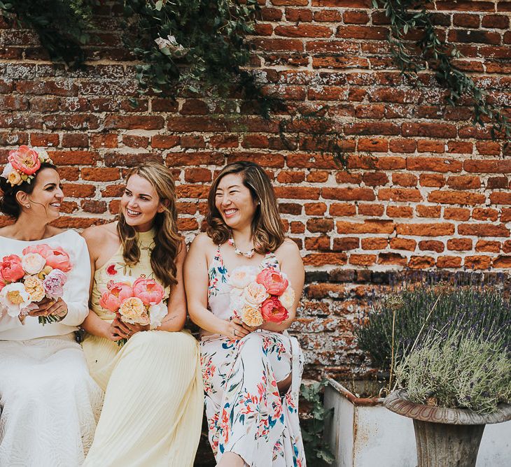 Bride in Halfpenny London Separates of Laura Top with Cowl Back and Long Sleeves, Silk Cami and Laser Cut Palm Skirt | Flower Crown with Pink Peony | Bridesmaids in Mismatched Embroidered Dresses | Colourful Bouquets of Pink and White Peonies | 'Frida Kahlo' Flower Crown, Halfpenny London Bridal Separates and Colourful Bouquets with Peonies for Suffolk Wedding | From The Smiths Photography