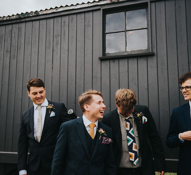 Groom in Navy Tweed Suit by Walker Slater with Yellow Tie and Patterned Pocket Square | Groomsmen in Mismatched Navy Suits | 'Frida Kahlo' Flower Crown, Halfpenny London Bridal Separates and Colourful Bouquets with Peonies for Suffolk Wedding | From The Smiths Photography