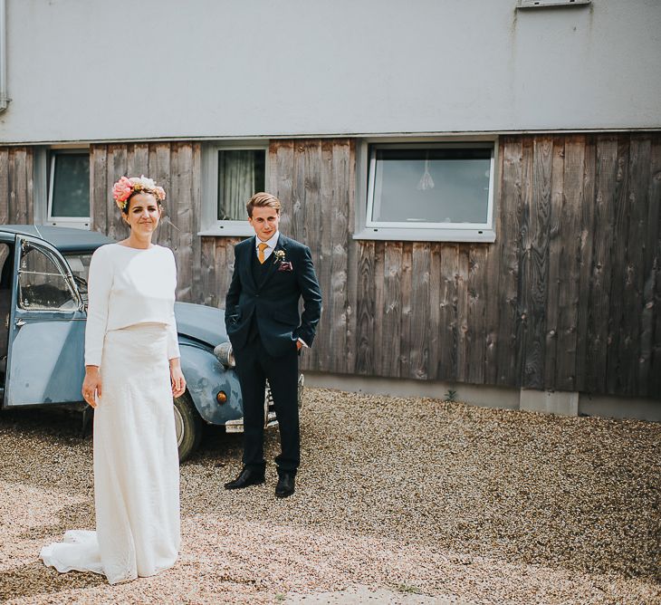 Bride in Halfpenny London Separates of Laura Top with Cowl Back and Long Sleeves, Silk Cami and Laser Cut Palm Skirt | Flower Crown with Pink Peony | Groom in Navy Tweed Suit by Walker Slater with Yellow Tie and Patterned Pocket Square | 'Frida Kahlo' Flower Crown, Halfpenny London Bridal Separates and Colourful Bouquets with Peonies for Suffolk Wedding | From The Smiths Photography