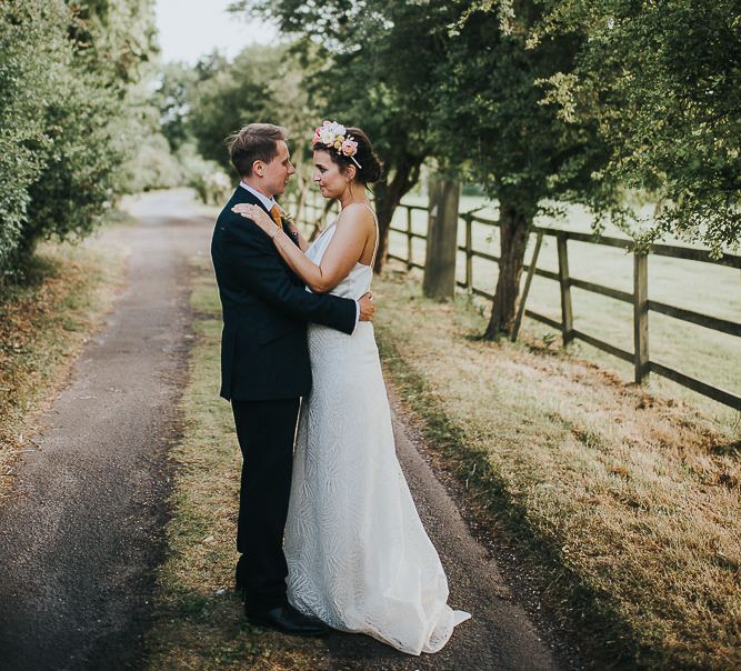 Bride in Halfpenny London Separates of Laura Top with Cowl Back and Long Sleeves, Silk Cami and Laser Cut Palm Skirt | Flower Crown with Pink Peony | Groom in Navy Tweed Suit by Walker Slater with Yellow Tie and Patterned Pocket Square | Colourful Bridal Bouquet of Pink and White Peonies | Suffolk Wedding | From The Smiths Photography