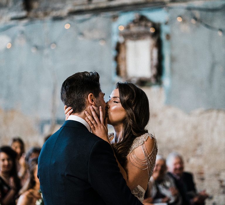 Bride and Groom Kiss During Ceremony