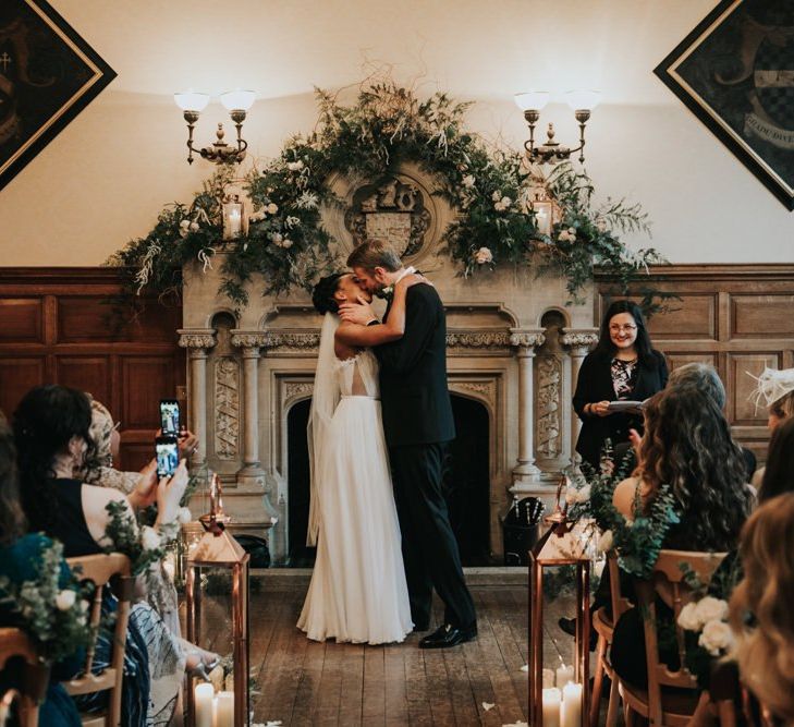 Bride and groom kissing at The Elvetham wedding ceremony