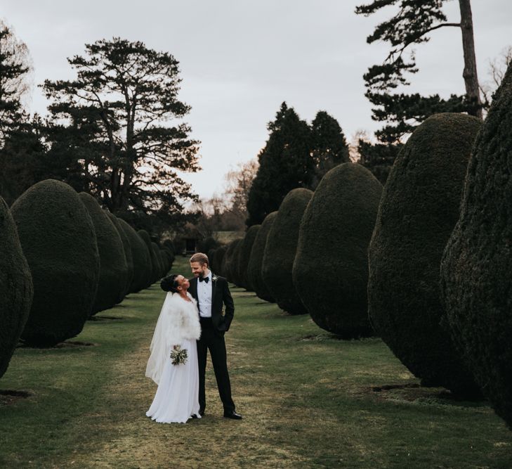 Bride and groom portrait in the gardens at The Elvetham wedding venue