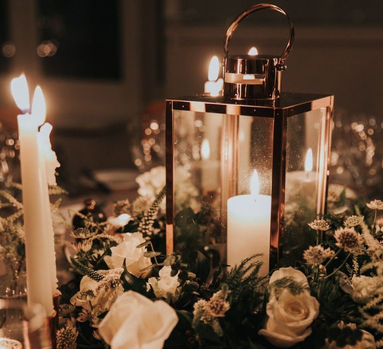 Table centrepiece with candles and flower arrangement