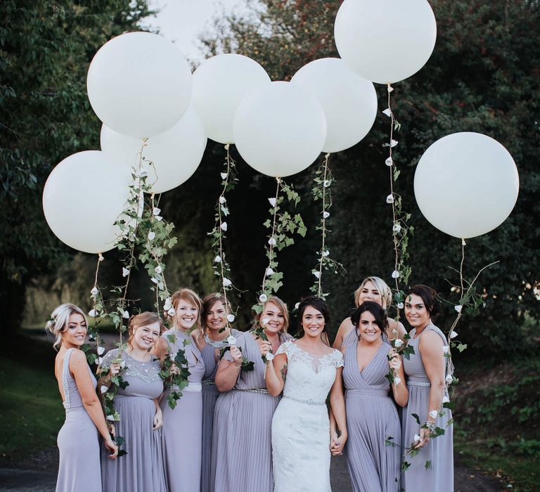 Bridal Party Holding Giant White Balloons with Ivy Vine String