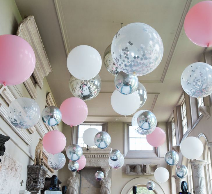 Pink, White and Clear Helium Filled Giant Balloons Lining the Ceiling