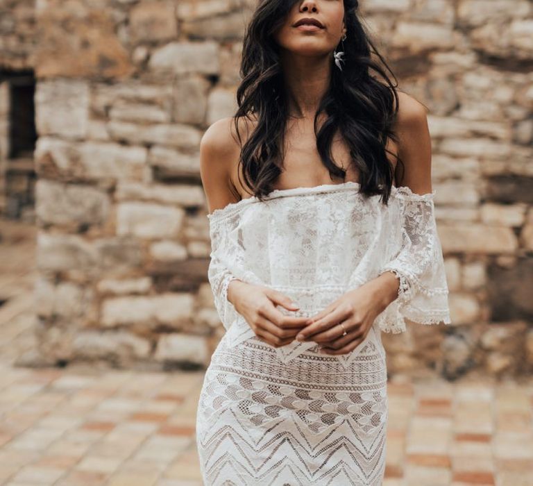 Bride with Wavy Black Hair in Off The Shoulder Lace Wedding Dress