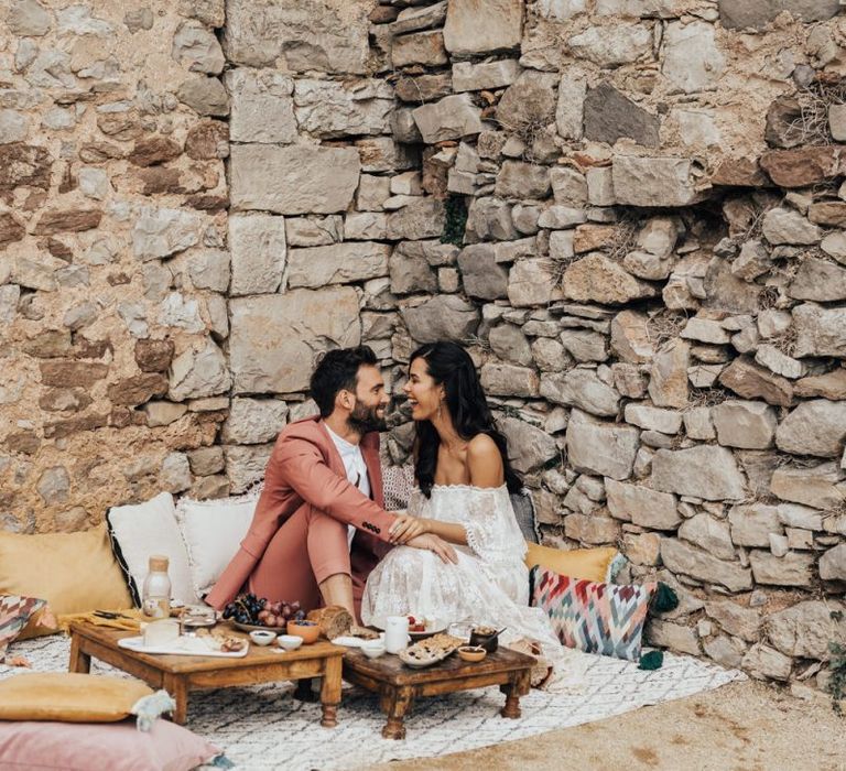 Bride and Groom Enjoying an Intimate Grazing Table