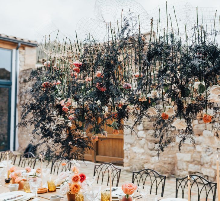 Hanging Flower Stems and Foliage Over Wedding Reception Table