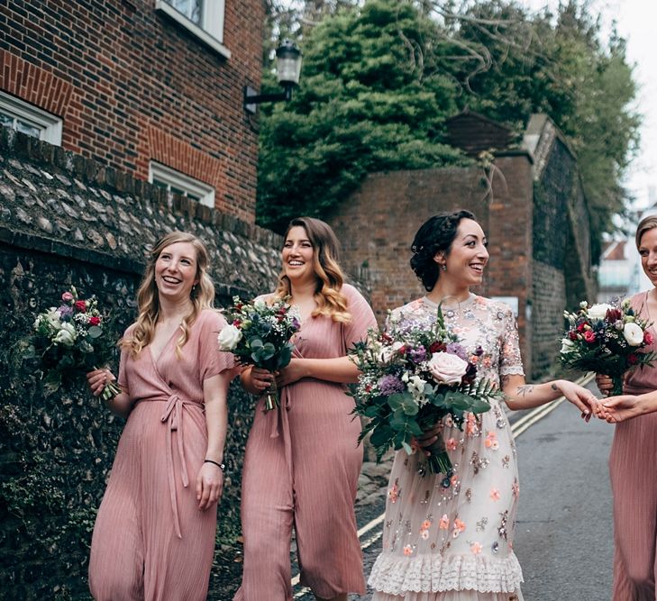 Bridesmaids In Pink Jumpsuits // Beautiful DIY Village Hall Wedding For Under £5k // Guests Made Food // Bride Wears Needle &amp; Thread // Images By Dale Weeks Photography