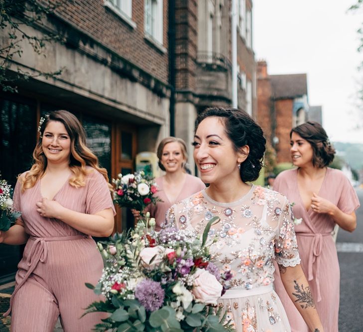 Bridesmaids In Pink Jumpsuits // Beautiful DIY Village Hall Wedding For Under £5k // Guests Made Food // Bride Wears Needle &amp; Thread // Images By Dale Weeks Photography