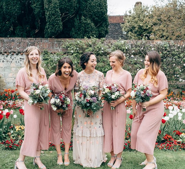 Bridesmaids In Pink Jumpsuits // Beautiful DIY Village Hall Wedding For Under £5k // Guests Made Food // Bride Wears Needle &amp; Thread // Images By Dale Weeks Photography