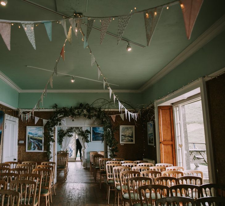 Foliage Arch | Pastel Bunting | Fairy Lights | Wedding Ceremony at The Druidstone | Mykonos Rewritten Bridesmaid Dresses for an Epic Clifftop Coastal Wedding | Nic Ford Photography