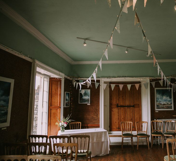 Pastel Bunting | Fairy Lights | Wedding Ceremony at The Druidstone | Mykonos Rewritten Bridesmaid Dresses for an Epic Clifftop Coastal Wedding | Nic Ford Photography