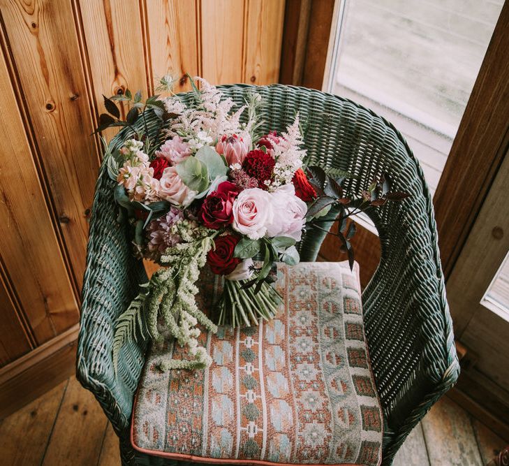 Bridal Bouquet of Burgundy and Blush Flowers with Foliage | Mykonos Rewritten Bridesmaid Dresses for an Epic Clifftop Coastal Wedding | Nic Ford Photography