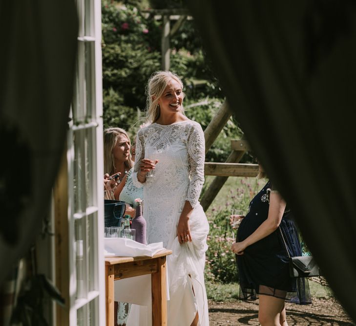 Bride in Grace Loves Lace Inca Gown with Boat Neck, Lace Sleeves and Low Back | Wedding Reception at The Druidstone | Mykonos Rewritten Bridesmaid Dresses for an Epic Clifftop Coastal Wedding | Nic Ford Photography