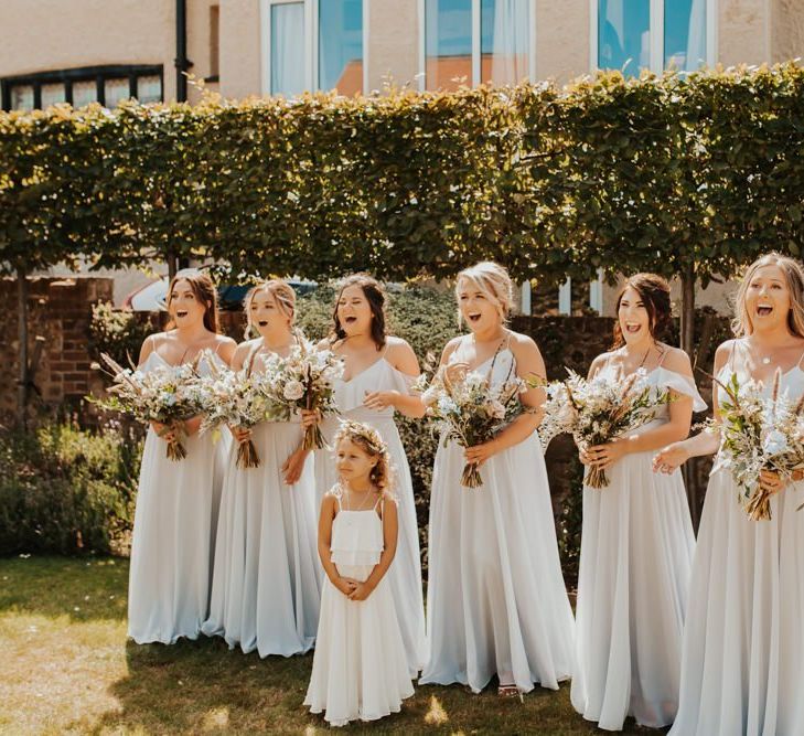 Bridal party first look in light blue dresses