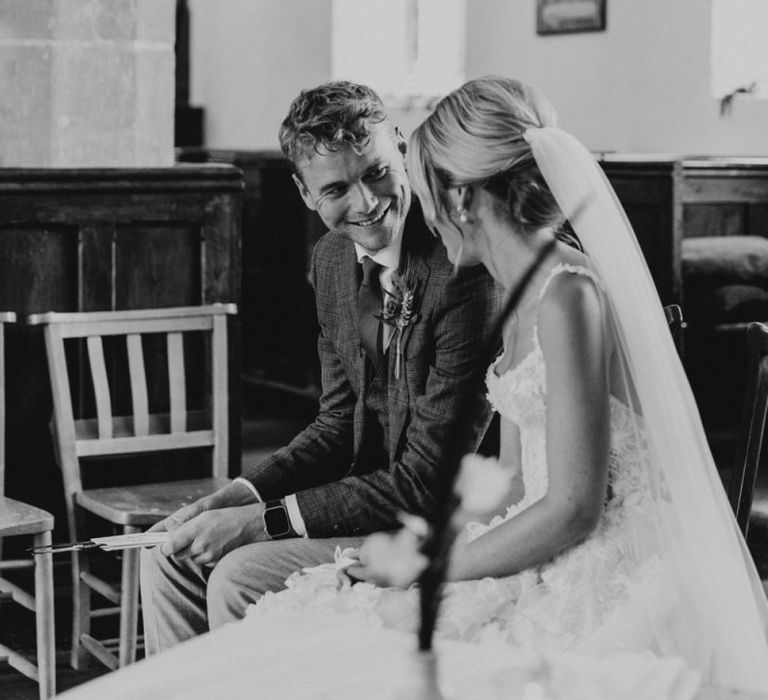 Intimate moment of the bride and groom at the church wedding