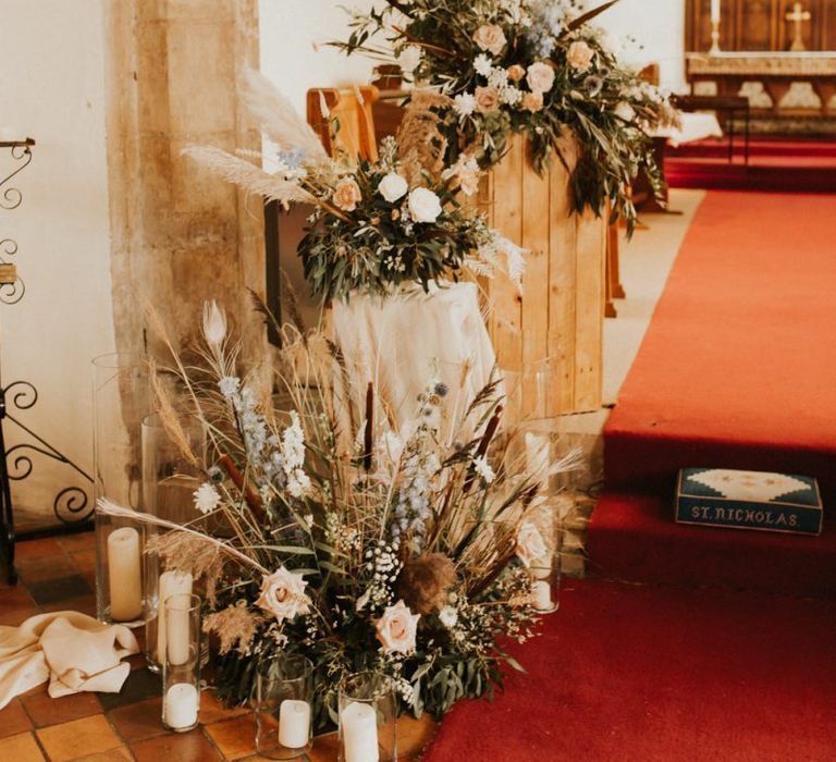 Neutral dried flower and grass floral arrangement in the church